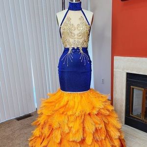 I AM SELLING MY CUSTOM MADE PROM DRESS IT WAS ONLY WORN ONCE.